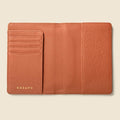 Tan leather passport wallet with RFID protection and multiple pockets for cards and cash