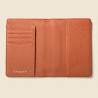 Tan leather passport wallet with RFID protection and multiple pockets for cards and cash