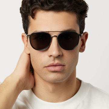 Man wearing Camden by DIFF polarized sunglasses with metal-on-acetate details and double nose bridge